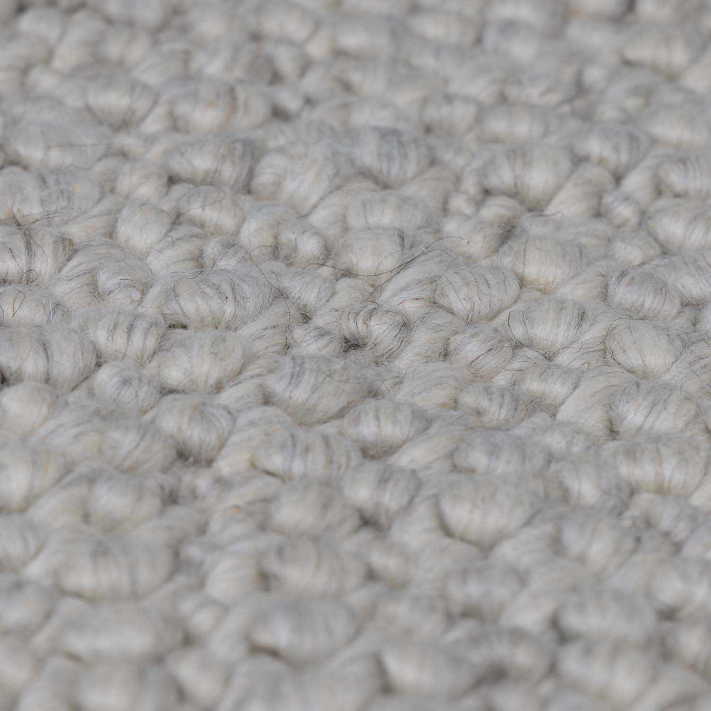 Penmaen Solid Cream Hand-Woven Wool Rug