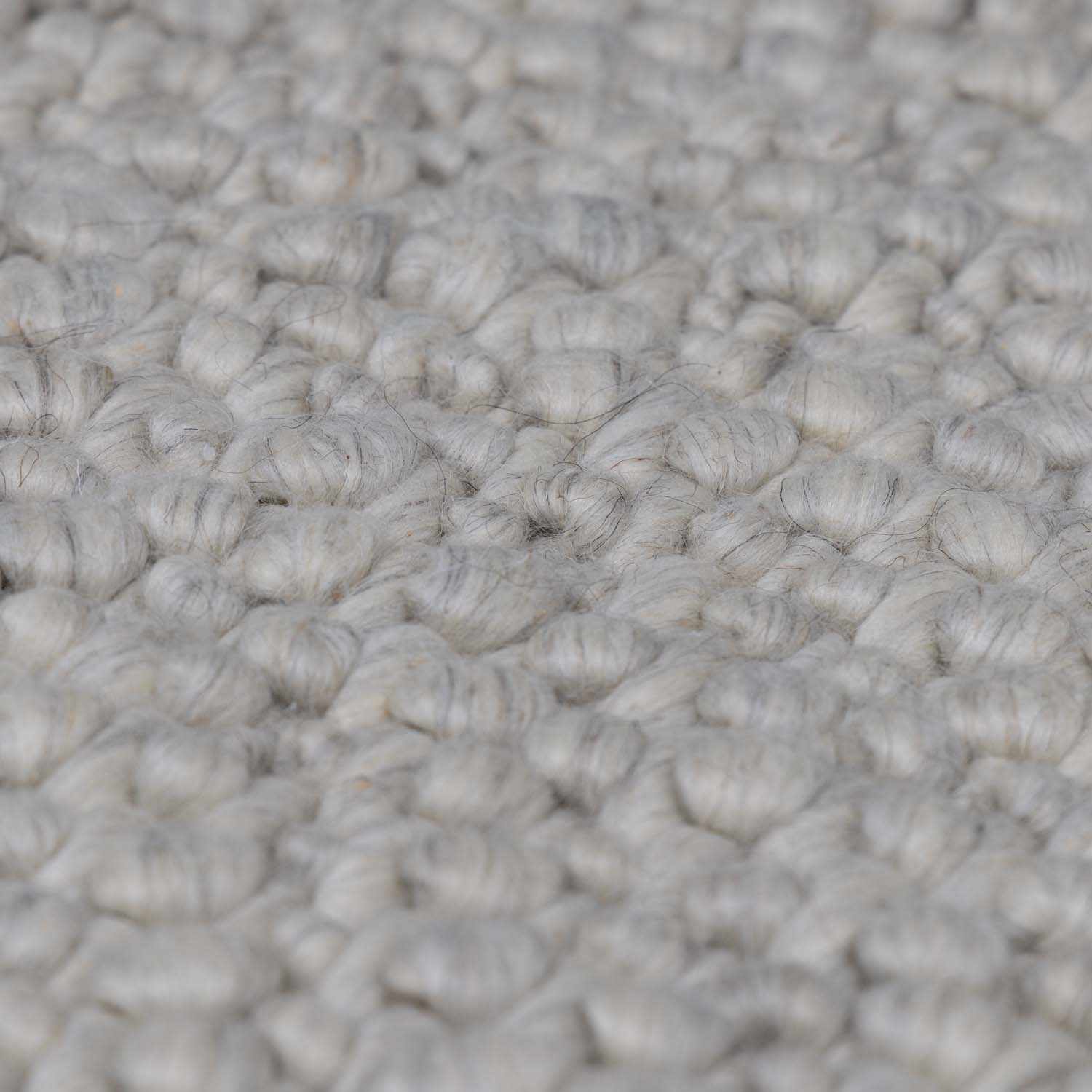 Penmaen Solid Cream Hand-Woven Wool Rug